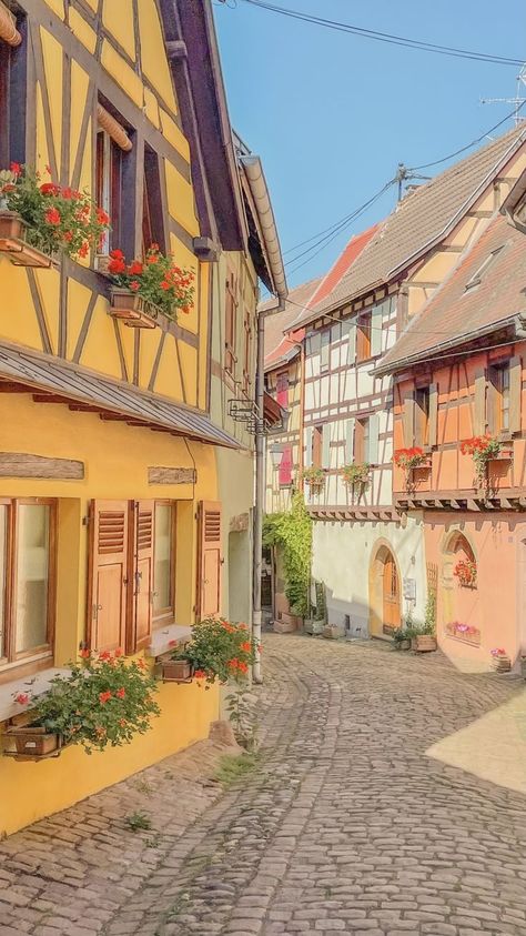 pastel streets of one of the most beautiful town in France to visit Eguisheim Town Reference Photo, Europe Town Aesthetic, Small French Town Aesthetic, Pastel Country Aesthetic, Cottagecore Town Aesthetic, Small French Town, Small Town France, Cute Town Aesthetic, City Landscape Reference