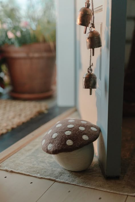 Cutie artisan felted mushroom doorstops for your home. sold individually approximate size 8” diameter at top x 6.75” h 100% wool outer, sand-filled cotton bag for weight handmade in Nepal PLEASE NOTE: each piece will have variations in design and size as this is a one-of-a-kind handmade product Fall Mushroom Decor, Wool Mushroom, Diy Doorstop, Moss Rug, Mushroom Cottage, Felt Mushroom, Mushroom Decor, Craft Night, Door Stop