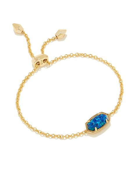 Versatile, fun, and adjustable(!), the Elaina Gold Delicate Chain Bracelet in Coblat Blue Kyocera Opal is the perfect addition to your arm stack party. Our iconic stone shape is centered on a dainty gold chain with an adjustable closure, fit for every style aesthetic and wrist size. Metal 14k Gold Over Brass Material Cobalt Blue Kyocera Opal Closure Slide Bead Size 9" L, 0.38" WDue to the one-of-a-kind nature of the medium, exact colors and patterns may vary slightly from the image shown. | Kend Blue And Gold Jewelry, Arm Stack, Kendra Scott Bracelet, Preppy Jewelry, Gold Chain Bracelet, Kendra Scott Necklace, Style Aesthetic, Delicate Chain, Dainty Bracelets