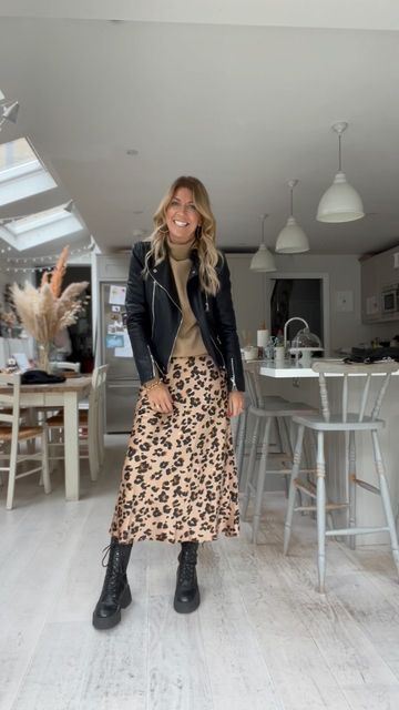 Animal Print Boots Outfit Winter, Satin Midi Skirt With Boots, Leopard Print Satin Skirt Outfit, Leopard Print Skirts, Classy Boho Outfits, Animal Print Skirt Outfit Winter, Leopard Skirt Outfit 2024, Leopard Satin Skirt Outfit, Leopard Skirt Outfit Winter