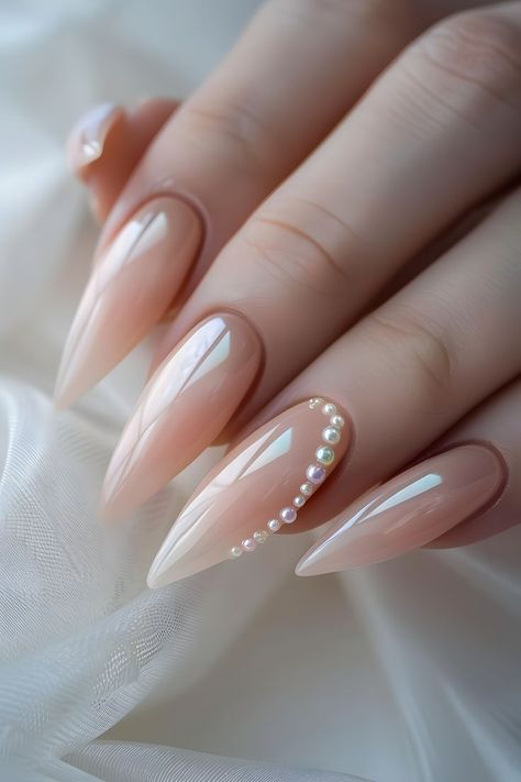 Adorn your nails with pale peach and pearl charms for an elegant look. Follow us for more cool nail art ideas. Visit our blog on the bride’s ultimate guide to perfect wedding nails. Simple Summer Nails | Wedding Day Nails | Nails Design Summer | Elegant Nails | Trendy Nails | Nails With Charms | Nails 2024 Summer | Elegant Touch Nails | Nails Summer 2024 | Nails Elegant Classy | Minimalist Nails | Almond Nails | Nails Easy | Nails Inspo 2024 | Nails Design | Nails Design With Rhinestones Nails With Pearl, Wedding Day Nails, Bridal Nails Designs, Engagement Nails, Peach Nails, Summer Nail Art, Pale Peach, Peachy Keen, Pearl Nails