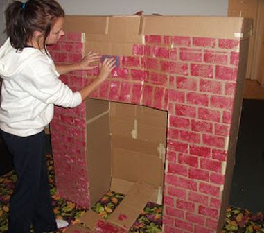 Cardboard fireplace | thedomesticbarbie Make A Fireplace Mantel, Paper Fireplace, Make A Fireplace, Diy Christmas Fireplace, Cardboard Fireplace, Fake Fireplace, Christmas Play, Christmas Fireplace, Diy Fireplace