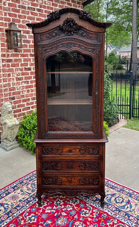 BEAUTIFUL Antique French Country Carved Oak Bonnet Top Bookcase, Bonnetiere or Vitrine Over 3 Drawer Chest ~~HIGHLY CARVED~~c. 1870s Versatile size~~SLIM profile fits in smaller spaces~~84" tall x 31.5" wide x 14" deep~~removable "bonnet" top PERFECT for displaying your favorite antique books and collectibles~~lower chest for extra storage Exquisite crossed torch, lovebird, rose and ribbon carvings~~old pegged construction~~original "wavy" glass and original key included Three (3) drawers in low Old Antique House Decor, Small Victorian Dining Room, Witchy House Aesthetic, 1800s Furniture, Waterfall Bookcase, Victorian Furniture Antique, Antique Wooden Furniture, Victorian Furniture Decor, Old Wooden Furniture