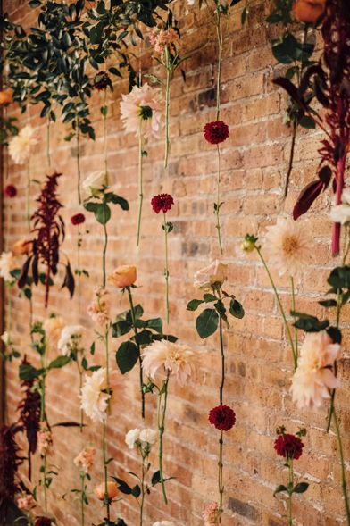 Wedding Flower Wall Backdrop Fall, Rustic Boho Wedding Outdoor, Flowers On Brick Wall, Floating Flower Wall Wedding, Wedding Decor Brick Wall, Wedding Backdrop Brick Wall, Wedding Photo Backdrop Brick Wall, Brick Wall Floral Backdrop, Wedding Brick Wall Decor