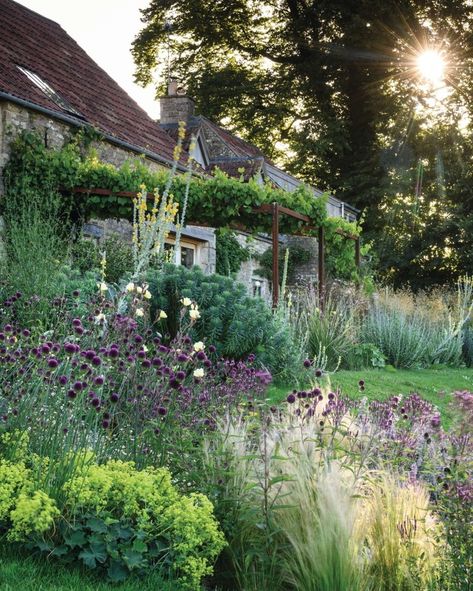 Out of the rubble of a former brownfield site, Jo McKerr has created a beautiful and natural managed-meadow garden. 'When you look down on Jo McKerr’s wonderful meadows and over to the hills beyond it is easy to get seduced into romantic notions about pastoral idylls. Her expansive naturalistic planting style means the garden teems with wildlife, pollinators buzz and at night bats swoop from her 70m-long abandoned canal tunnel on to this rich, biodiverse landscape. But it wasn’t always this ... Naturalistic Garden, On Jo, Meadow Garden, Perennial Border, Permaculture Design, Gravel Garden, Magical Garden, Propagating Plants, Rustic Gardens