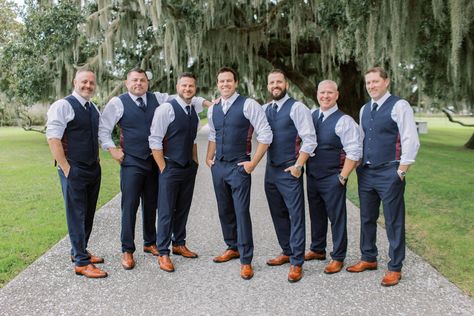 Groom and groomsmen pose for pictures before charming southern wedding. Love their cognac shoes and blue pants and vests! Check out the rest of the wedding at thebridalfinery.com. Blue and tan menswear // mens wedding fashion // groomsmen ideas // groomsmen outfits Groomsmen Just Vests, Gray Vest And Pants Groomsmen, Navy Blue Beach Wedding Groomsmen, Groomsmen Just Shirt And Tie, Vest Only Groomsmen, Open Collar Groomsmen, No Jacket Wedding Groom Attire, Groomsmen Vest And Bowtie, Navy Vest Outfit Mens