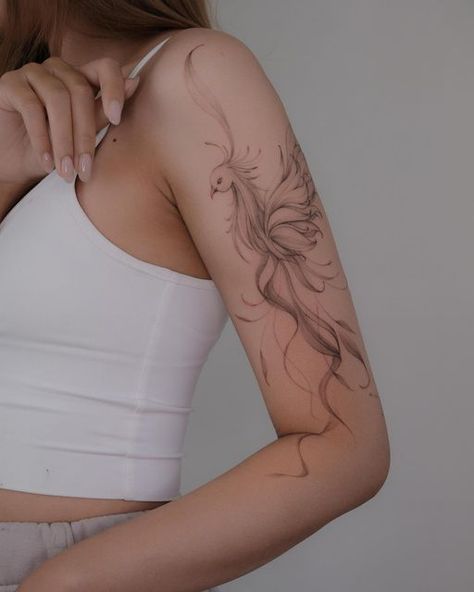 Pheonix Tattoo For Women Simple, Flowy Arm Tattoo, Ornamental Phoenix Tattoo, Phoenix Upper Arm Tattoo, Floral Phoenix Tattoo, Phoenix Tattoo On Arm, Phönix Tattoo Women Arm, Fine Line Pheonix Tattoo For Women, Phoenix Tattoo Feminine Arm Sleeve