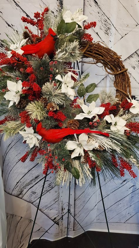 "#winterwreath #christmaswreath  Red Cardinal Winter Wreath sit on a 18\" grapevine base.  Dimension 35×30 This beautiful wreath will carry you through the winter  Two beautiful red cardinal perched on Snow covered Pine branches  Frosted red berry Small white and silver poinsettia  Christmas Pine  AnotherGratefulCreationbyCC"