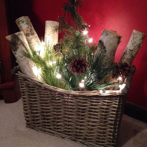 Birch logs, greens, lights and pine cones in a basket Christmas Balls Diy, Christmas Planters, Christmas Porch Decor, Christmas Decorations Diy Outdoor, Christmas Arrangements, Christmas Door Decorations, Christmas Porch, Christmas Decorations Rustic, Farmhouse Christmas Decor