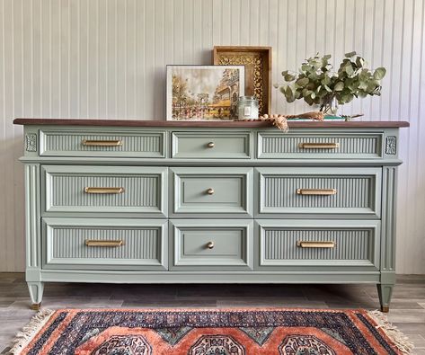 *Shipping is NOT FREE. Please message us with your zip code to get started.* *Item is NOT available to purchase/ has sold* MCM dresser/ sideboard refinished in a mid-tone finish with gray and warm green tones, fluted drawer fronts and vintage brushed brass pulls. Upper drawers are lined with vintage birds and berries floral paper. Dovetailed joint drawers slide smooth on wood tracks. Clean interior. L: 64 " W: 20" H : 32 1/4 " This piece has been preloved and shows signs of use and aging, adding Dark Green Dresser Makeover, Light Green Dressers Painted, Coastal Modern Furniture, Green Dresser Bedroom, Cool Dresser, Mint Dresser, Green Dresser Makeover, Refinished Bedroom Furniture, Refinished Buffet