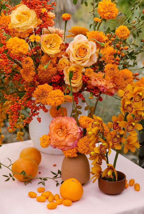 opulent citrus tone wedding reception floral centerpieces incorporating fresh tomatoes and oranges Sophisticated Garden, Orange Centerpieces, Marigold Wedding, Orange Bouquets, Orange Wedding Flowers, Citrus Wedding, Fleur Orange, Boda Mexicana, Creative Freedom