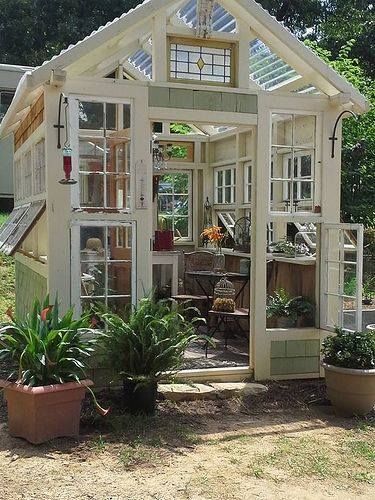 Greenhouse out of windows Hip Roof Greenhouse, Greenhouse Salvaged Windows, Green House From Windows, Green House Recycled Windows, Greenhouse Vintage Windows, Walk Through Greenhouse, Window Frame Greenhouse, Recycled Window Greenhouse Diy, Salvaged Window Greenhouse