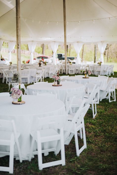 50x80 High Peak Pole Tent, Leg Drapes, 21x21 Dance Floor, White resin Padded Chairs, 60" Round Tables with 120" Round White Linens. Call today and let one of our experienced sales team members help you to build your vision! White Resin Chairs Wedding Receptions, Tropical Wedding Reception Decor, Wedding Tent Layout, Tropical Wedding Reception, White Plastic Chairs, White Round Tablecloths, Wedding Reception Chairs, Wedding Tent Decorations, White Folding Chairs