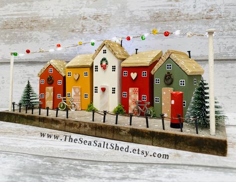 Christmas Scene with working lights! Handcrafted and designed by The SeaSalt Shed Diy Scrap Wood Christmas Village, Painted Wooden Christmas Village Houses, Christmas Scene Craft, Wooden Houses Christmas Decoration, Small Wooden House Decor, Wooden Christmas Houses Craft, Diy Wood Houses Christmas, Wood Block Houses Christmas, Christmas Mini Houses