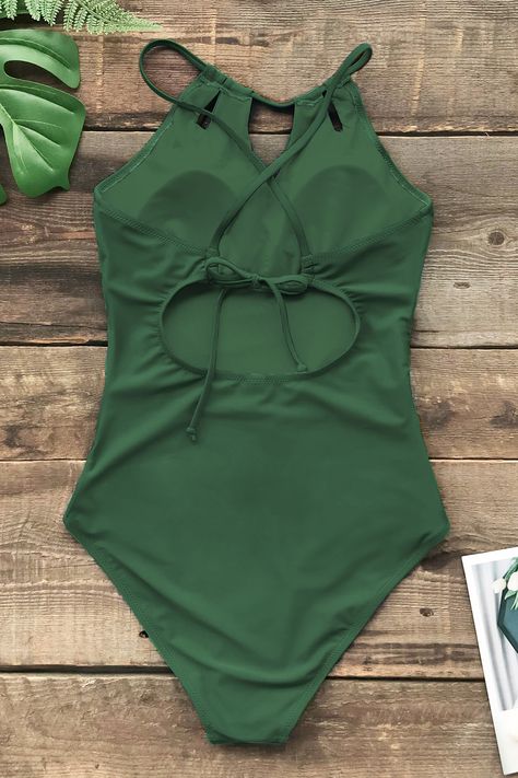 This Ruching High Neck One Piece Swimsuit features a sophisticated high neck design, creating a sleek and elegant silhouette. The back tie detail adds a touch of allure while allowing for a customizable fit. With delicate ruching, this swimsuit accentuates your curves for a flattering and stylish look, making it a must-have for your next beach getaway. Product code: 321-150031G Features:  High Neck Removable Soft Cups Back Tie Ruching Lining: 92%POLYESTER,8%SPANDEX Material: 80%NYLON,20%SPANDEX. Suit Green, High Neck One Piece, High Neck Designs, Beach Getaway, Swimwear Beach, Beach Getaways, Soft Cup, Beach Look, One Piece For Women