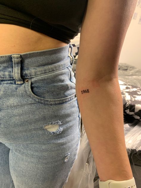 Two Years Tattoo, Tattoo Ideas Year Of Birth, Year Tattoos On Arm, 1957 Tattoo Number, 18th Bday Tattoo Ideas, Small Years Tattoo, Tiny Birth Year Tattoo, Year Date Tattoo Ideas, 2010 Tattoo Number