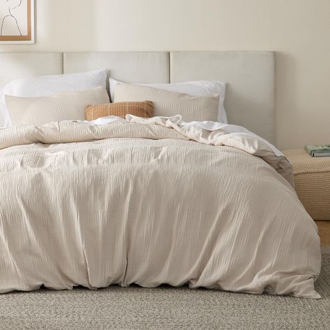 PRICES MAY VARY. Faux-Muslin Waffle Wave: The faux-muslin design with a waffle texture on this duvet cover set elevates your home decor with its elegant and sophisticated charm. Lightweight: Featuring a naturally wrinkled faux-muslin texture, this duvet cover set is naturally airy, lightweight, and breathable. Durable and Safe: The duvet cover set is woven with even and dense stitching, providing increased durability against pulls and snags. It is also Standard 100 by OEKO-TEX certified for its Off White Duvet Cover, Amazon Duvet Cover, Tan Comforter Bedroom Ideas, Comforter Inspiration, Oatmeal Bedding, Duvet Covers Aesthetic, Tan Comforter, Greige Bedroom, Beige Duvet Cover