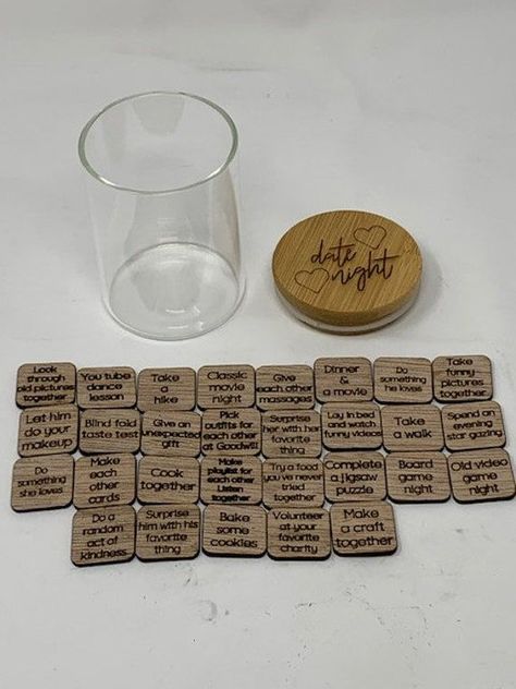 Keep date nights exciting. Whether you just started dating, or have been in a relationship / married for over 10 years, the date ideas on these wooden tiles are guaranteed to be unique and provide a fun date. Material: wood and glass Item dimensions: WxH - 2.5x3.75 inches Includes: 29 wooden tiles with different Date Night ideas, 7 oz jar🔆#LoveStory #RomanticEncounters #HeartfeltConnections #DateNightIdeas #SoulmateSearch #FlirtyFridays #CandlelitDinners #StarryEyedMoments #LoveQuotes #DreamyDates #WhisperedPromises #AmourAdventures Earring Holder Display, Night Jar, Date Night Jar, Wooden Tiles, Truck Gifts, Candlelit Dinner, Wooden Tile, Date Night Ideas, Together Lets