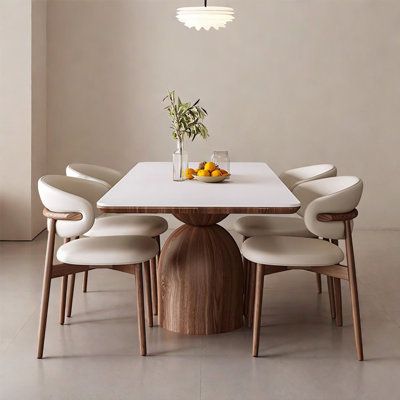 This is a simple style dining table. It is composed of rock plate table top, multi-layer solid wood bearing board and two semi-circular bases, with a sense of design, unique shape and dynamic. The table is supported by thick rock slab and multi-layer solid wood, which is resistant to wear and scratches and has strong load-bearing capacity. The base is made of ash wood solid wood, stable and tough, but also resistant to corrosion and moisture, bearing capacity is stronger, not easy to deformation Condo Dining Table, Modern Classic Dining Room, Modern Classic Dining, Restoration Hardware Dining Room, Round Extendable Table, Rectangular Dining Tables, Mid Century Modern Dining Table, Timeless Dining Table, Restoration Hardware Dining