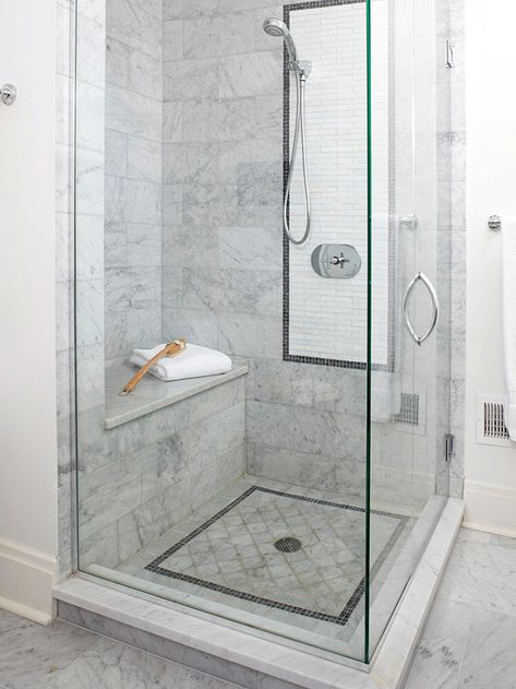 Corner Shower   Make the most of an awkward bathroom corner with a slender shower stall. This small shower was fitted into a bathroom corner and feels more spacious than it small size suggests, thanks to the glass enclosure, which lets in plenty of light. Decorative tile and chrome fixtures give the petite space panache. Makeover Kamar Mandi, Toilette Design, Bilik Air, Marble Showers, Bathroom Shower Tile, Subway Tiles, Versace Home, 아파트 인테리어, Corner Shower