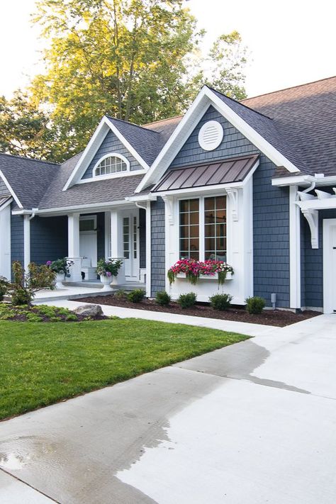 Lake House Exterior - Dark grey charcoal vinyl shake siding with white trim, pergola, window boxes and corbel details. Blue With White Trim House, Blue Grey White House Exterior, Exterior Paint Colors For Bilevel House, Navy Exterior House Colors White Trim, Navy House With White Trim, Dark Blue Houses With White Trim, Mastic Natural Slate Siding, Trendy House Paint Colors Exterior, Dark Siding With Black Trim