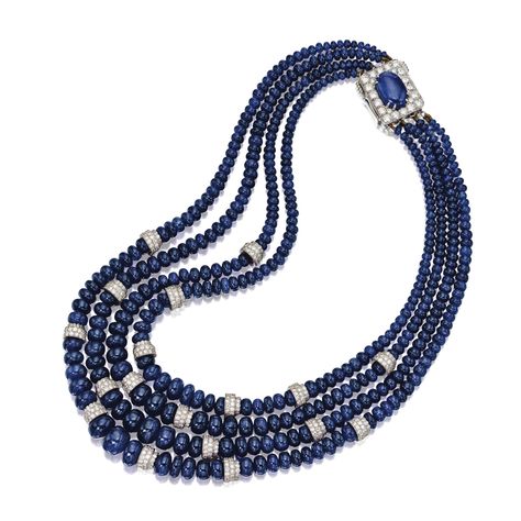 SAPPHIRE AND DIAMOND BEAD NECKLACE, DAVID WEBB The four-strand necklace composed of numerous sapphire beads graduating from approximately 10.5 to 3.1 mm., enhanced with 18 rondelles set with numerous small round diamonds weighing approximately 11.50 carats, completed by a rectangular clasp centering an oval cabochon sapphire weighing approximately 8.30 carats, framed by additional round diamonds weighing approximately 2.00 carats, mounted in platinum and 18 karat white gold, signed Webb. Diamond And Sapphire Necklace, Sapphire Beads, David Webb, Necklace Clasps, Elegant Necklaces, Bead Jewellery, Oval Cabochon, Strand Necklace, Gold Design