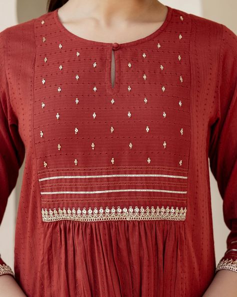 Eid Collection - New Arrivals! Beautiful crafted on a muted rust red, our Ayat Kurta is festive enough for a celebration and casual enough for a day in! The textured dobby yoke is delicately dotted with sequin and silver gota trims. Shop the Eid Collection in stores and online www.cottonsjaipur.com [ Cottons, Cotton Kurta, Eid Collection, Eid Mubarak, Celebration, Auspicious, Ethnic wear, Festive, Minimal, Traditional, Handmade Kurta] #cottons #cottonsjaipur #newarrivals #eid #eidmubara... Churidar Embroidery, Yoke Designs, Idea Embroidery, Minimal Traditional, Kurti Sleeves, Cotton Tops Designs, Simple Kurti, Kurti Sleeves Design, Designer Kurti Patterns