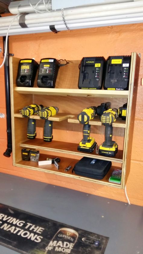 Workshop battery drill charging station easy diy plywood project Drill Charger Station Diy, Drill And Charger Storage, Charging Station Ideas Garage, Ryobi Battery Charging Station, Garage Battery Charging Station, Battery Charging Station, Battery Drill, Garage Workshop Organization, Plywood Projects