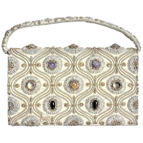 For Sale on 1stDibs - This vintage ornately embroidered and decorated clutch styled evening handbag was made in India in approximately 1940 in the period Anglo-Indian style. Purse Handmade, Silk Bag, Silver Bags, Vintage Clutch, Clutch Purse Evening, Fashion Collage, Evening Handbag, Evening Purse, Embroidered Bag