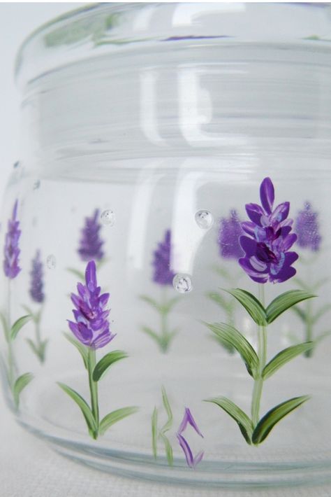 Purple lavender, delicate greens, dew drops. Painting A Glass Jar, Jar Painting Ideas Cute Easy Flower, Cute Jar Designs, Glass Jar Art Painting, Painting Candle Jars, Acrylic Painting On Glass Jars, Jars Painting Ideas, Candle Jar Painting Ideas, Painting Glass Jars Acrylic