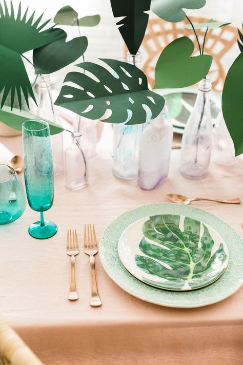 Tropical plants have been quite the rage in party and home decor. I’ve...  Read more » Tropical Dinner Table, Tropical Tablescape Summer, Tropical Round Table Decor, Tropical Leaves Table Decor, Tropical Corporate Event, Tropical Room Ideas, Tropical House Decor, Tropical Chic Decor, Tropical Trend