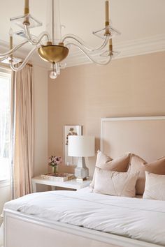 Bedroom Pillows Arrangement, Blue Upholstered Bed, White Wooden Bed, Blush Pink Bedroom, Blush Bedroom, Pink Headboard, Restful Bedrooms, Acrylic Chandelier, White Bedside Table