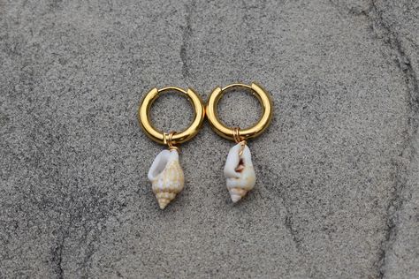 These earrings are handmade. they are very secure to your ear once clasped, and feature natural mini shells! since the shells are real and natural, every pair of earrings will be unique and one of kind. please message us with any questions about this item! Jewelry Nails, Shell Hoop Earrings, Cowrie Shell Jewelry, Gold Huggies, Cone Shell, Seashell Jewelry, Pinterest Ideas, Birthday Idea, Piercing Ideas