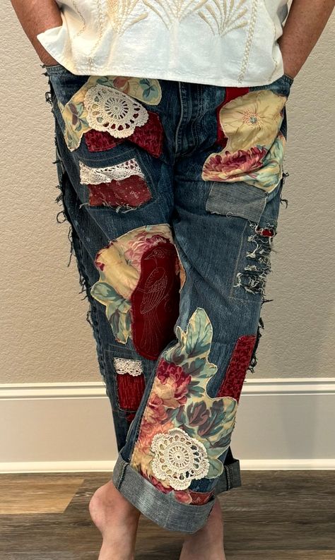 Upcycled art jeans! Big floral appliques, patching, hand bleaching and distressing, vintage trims plus a gorgeous embroidered bird make these comfortable boyfriend fit jeans a totally unique piece of wearable art. Adjustable button waist lets you customize the fit. Roll up the cuffs for a fun cropped look!. . Pants upcycled on RE.STATEMENT Patch Work Clothes, Artsy Boyfriend, Bleach Designs On Jeans, Upsize Jeans, Boro Jeans, Painting On Denim, Upcycle Pants, Patchwork Jeans Outfit, Decorated Jeans