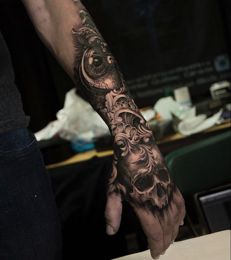 Stunning work in this human skull, eye and filigree piece, done on guy's hand & forearm by Pascal Malorni Reniere, an artist based in Montreal, Canada. Black And Grey Forearm Tattoo Men, Filigree Hand Tattoo, Forearm Tattoo Piece, Men Skull Tattoos, Forearm And Hand Tattoo, Skull Forearm Tattoo Men, Hand And Forearm Tattoo For Men, Eye On Hand Tattoo, Outside Forearm Tattoo Men Ideas