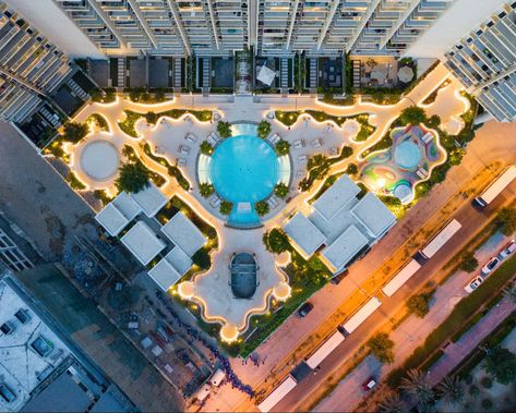 Contemporary Podium Landscape Architecture Design for Zaya Hameni Redesidential Tower, Dubai. Designed by Kamelia Landscape Design. Centered around a circular pool. The lighting design brings the landscape to life #kamelialandscapedesign #landscape #contemporarylandscaping #design #pool #poolideas #landscapearchitecture #lightingideas #design #podium #landscapedesign Building Podium Design, Podium Landscape Design, Podium Design Architecture, Circular Pool, Architecture Apartment, Biophilic Architecture, Residential Architecture Apartment, Podium Design, Landscape Design Plans