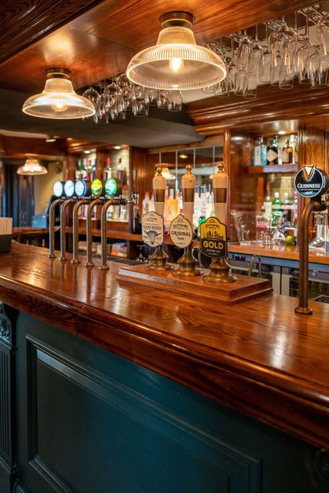 Glossy wooden bar with glasses hung above and with a variety of beers on draught. Bar And Pub Design, Australian Pub Interior, Pub Interior Ideas Modern, Traditional Pub Interior, Irish Bar Design, Pub Astethic, Pub Lighting Ideas, Behind Bar Wall Ideas, Pub Bar Ideas