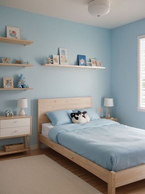 Create a light blue aesthetic bedroom by incorporating anime-inspired elements. Add a playful and eye-catching anime wall mural, complemented by a minimalist wooden bed frame and shelves adorned with anime figurines or artwork. Bedroom Ideas For Small Rooms Blue Wall, Light Blue House Aesthetic, Medium Blue Bedroom, Baby Blue Room Ideas, Minimalist Wooden Bed, Anime Wall Mural, Light Blue Wall Paint, Light Blue Room Aesthetic, Blue Aesthetic Bedroom