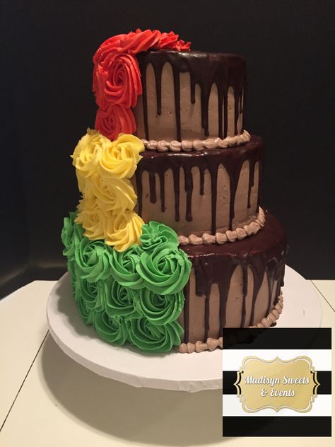 Wedding cake  Half bride and half groom Rasta themed rosettes and chocolate with ganache drip Rasta Wedding Theme, Rastafarian Wedding Ideas, Jamaican Wedding Cake, Reggae Wedding, Juneteenth Cookout, Rasta Cake, Bob Marley Cakes, Rasta Wedding, Jamaican Party