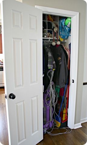 messy coat closet/ link to "after"  Drapery tie backs used as hooks for scarves, storing the vacuum cleaner!  Closet/mud room Coat Closet With Vacuum Storage, Coat And Vacuum Closet, Container Store Coat Closet, Coat Storage Small Space Closet, Vacuum Closet Organization, Where To Store Vacuum Cleaner, Store Vacuum Cleaner, Hallway Organization Ideas, Coat Storage Small Space