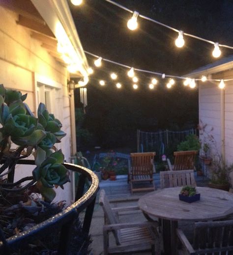 Easy to zig zag string lights between two buildings to create the perfect patio. These look like C9 stringers. Pick the strand color and bulb to fit your needs: http://www.partylights.com/Strings-Bulbs/C9-Strings-Bulbs Outdoor Deck Lighting, Outdoor String Lights Patio, Outdoor Lighting Design, Diy Outdoor Lighting, Backyard Canopy, Patio String Lights, Garden Canopy, Patio Canopy, Light Ideas