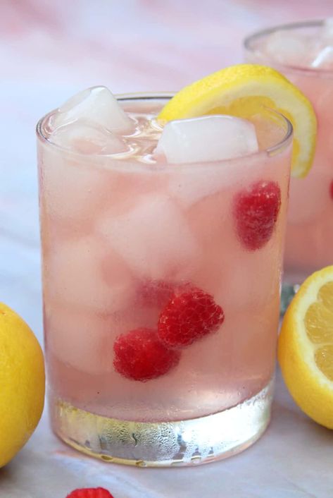 Raspberry Lemonade Vodka Spritzer | System of a Brown Raspberry Lemonade Vodka, Limoncello Cocktails, Coctails Recipes, Raspberry Vodka, Vodka Lemonade, Lemonade Cocktail, Refreshing Summer Cocktails, Spring Cocktails, Raspberry Syrup