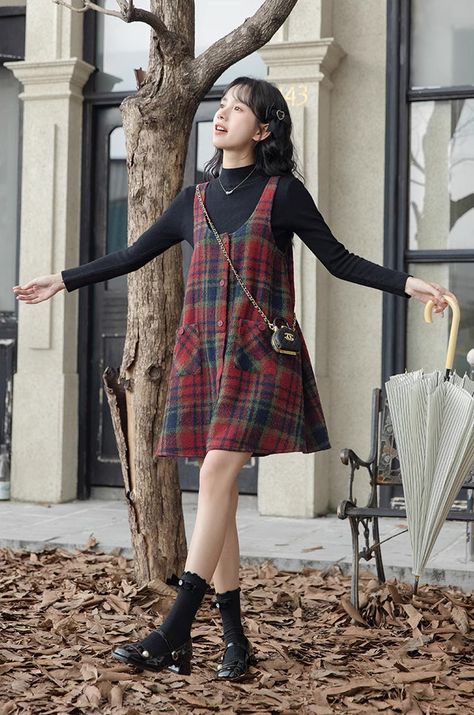 Button up mini cami dress with front pockets and an a-line tent silhouette for an easy roomy fit. S: 33" chest, 32" lengthM: 34.5" chest, 32" lengthL: 36" chest, 32" length Babydoll Smock Dress, Plaid Smock Dress, Plaid A Line Dress, Dresses With Under Shirts, Long Sleeve Top Under Dress, 90s Art Teacher Style, Dress Layered With Sweater, 90s Style Dress, Fleabag Outfits