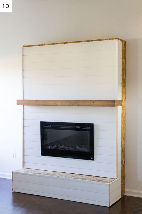 Ship lap boards being installed on a modern farmhouse electric fireplace surround and hearth Diy Electric Fireplace With Hearth, Built Ins With Electric Fireplace, Diy Fireplace With Hearth, Diy Hearth For Fireplace, Trim Around Fireplace, Diy Fireplace Hearth, Fireplace Fake, Faux Foyer, Diy Fireplaces