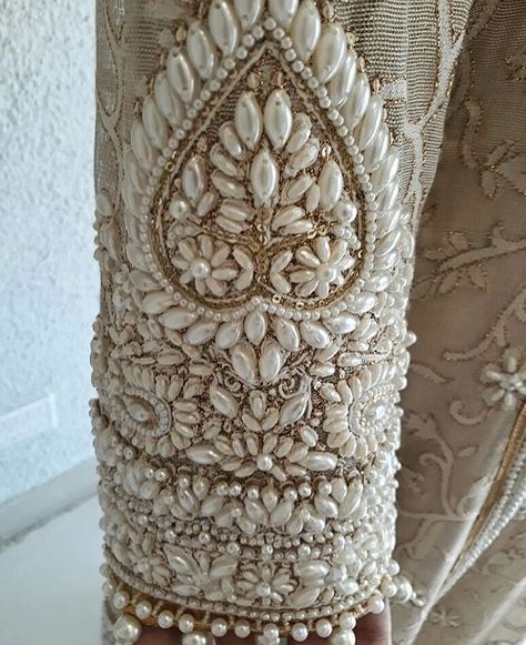 Pinterest: @pawank90 Indian Embellishment Details, Couture Beading Embellishments, Pearl Beads Embroidery, Couture Embellishment Details, Indian Embroidery Motifs, Pearl Beading Dress, Beading On Fabric Embellishments, Bridal Embroidery Designs, Pearl Handwork Embroidery