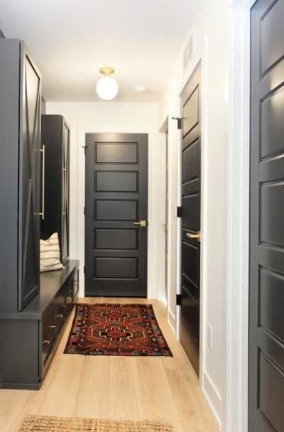 31 Black Interior Doors With White Trim Ideas - | Sebring Design Build Dark Painted Interior Doors And Trim, Black Interior Doors Black Hardware, Black Interior Doors With White Trim Light Wood Floors, Matte Black Trim Interior, Dark Door With White Trim, Interior Black Doors With Black Trim, House With Black Interior Doors, Black Interior Doors White Trim, White Trim Black Doors Interior