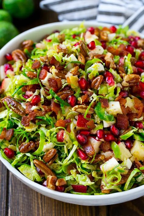 Brussels Sprout Salad Recipe | Shredded Brussels Sprouts Salad | Fall Salad #salad #brusselssprouts #bacon #thanksgiving #pomegranate #apple #dinner #dinneratthezoo Thanksgiving Pomegranate, Thanksgiving Dinner Recipes Sides, Healthy Brussel Sprout Recipes, Salad Fall, Salad Thanksgiving, Cheese Apples, Apple Dinner, Thanksgiving Dinner For Two, Sprout Recipe