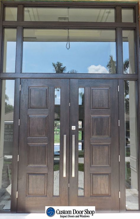 Large double front doors with sidelights and transom.  Mahogany wood doors with four panel design and stainless steel pulls. Front Door With Sidelight, Front Door With Sidelights, Door With Sidelights, Aluminium Front Door, Mahogany Wood Doors, Double Front Entry Doors, Double Door Entryway, Steel Front Door, Wood Exterior Door