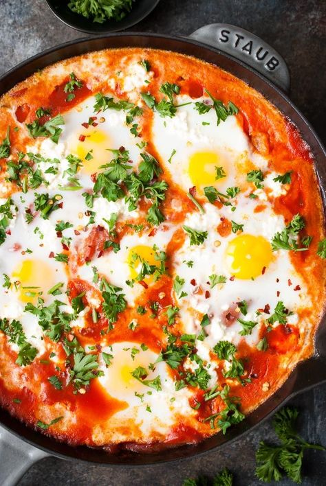 Shakshuka For those who don’t know, Skakshuka is a traditional middle eastern dish of eggs baked in a tomato sauce. But the best part is, you get to toast some crusty bread and dip it in this pan of deliciousness. It’s kind of genius if you ask me. lifeisbutadish.com #middleeasternbreakfast #eggbreakfast Eggs In Purgatory, Homemade Pita Bread, Shakshuka Recipes, Pain Pita, Tomato Relish, Spicy Tomato Sauce, Dessert Aux Fruits, Tomato Sauce Recipe, Spinach Recipes