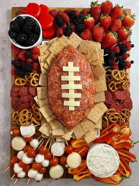 Is it even a Super Bowl party if there are no football shaped snacks? Whether you’re hosting or going to a friends for the Big Game, you can’t have a super bowl party without tasty snacks! This football shaped cheese ball is super easy to make and makes any cheese board a touchdown. You’ll see that my recipe includes all the goodies that taste delicious with this creamy, cheesy app, but feel free to tailor it to match your team’s colors! Cheese Ball Board, Football Shaped Food, Meat And Cheese Appetizers, Healthy Football Snacks, Shaped Cheese Ball, Football Shaped Foods, Football Desserts, Superbowl Desserts, Cream Cheese Ball